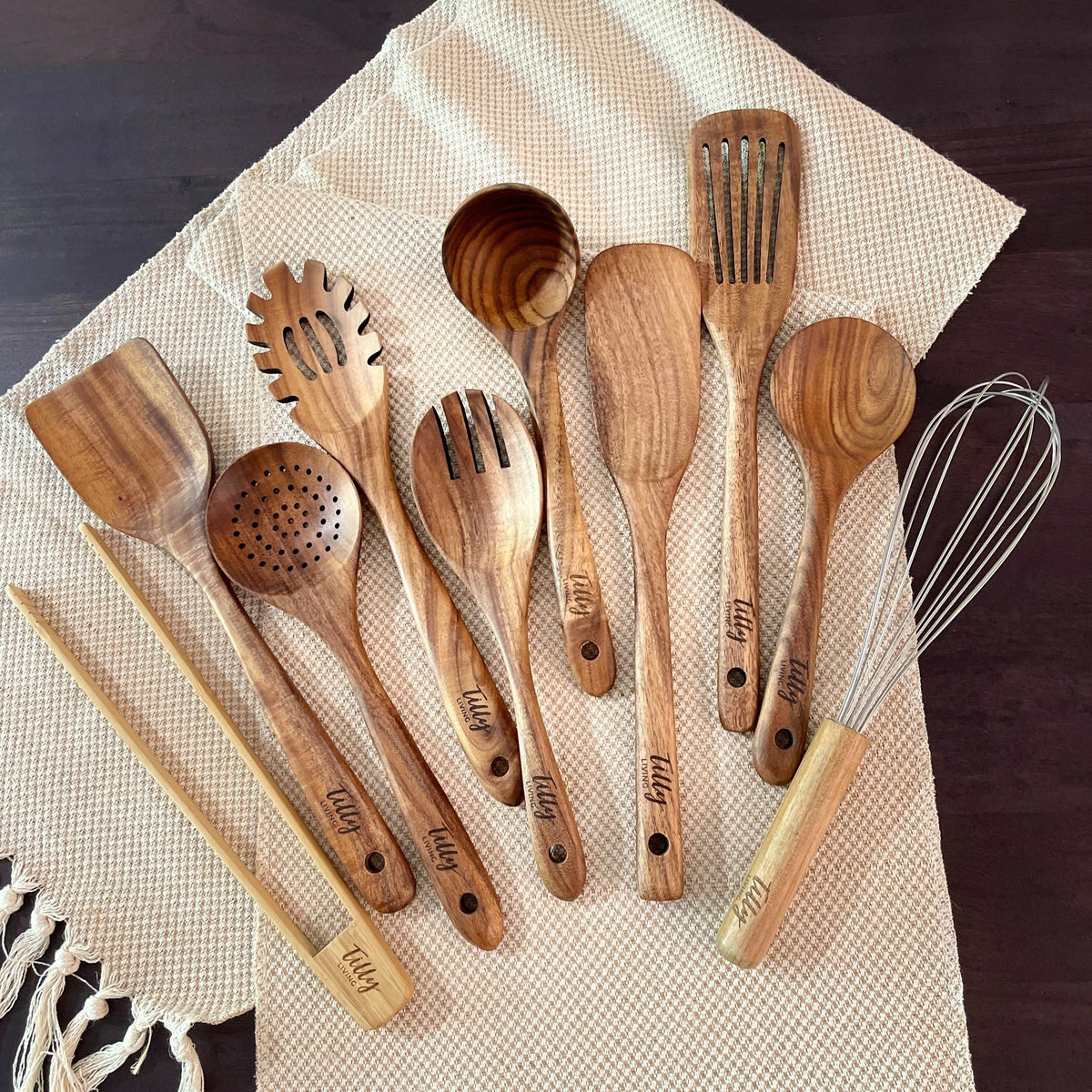 Tilly Living 10 piece teak wooden utensil set on natural cloth